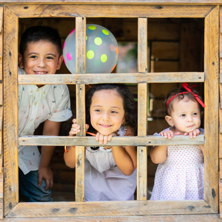 Kids standing in window